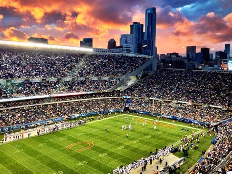 a large stadium filled with lots of people watching a soccer game in ...