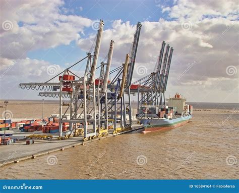 Cranes and cargo ship stock photo. Image of international - 16584164