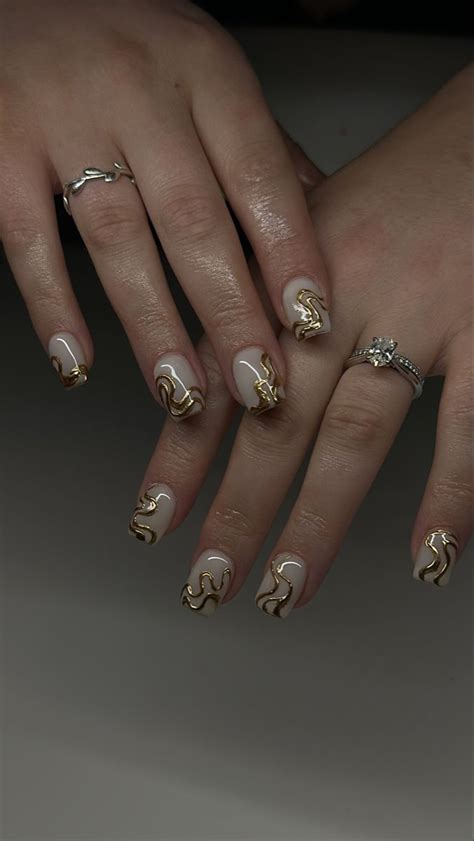 Gold swirl nail art