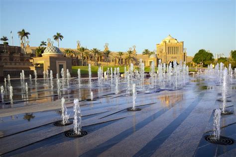 Emirates Palace in Abu Dhabi Reflected on the Ground Level Fountain at ...