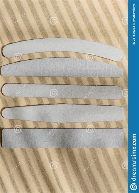 Different Types and Shapes of Nail Files on Sandy Background with Hard Shadows. Mockup Stock ...