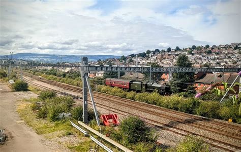 LMS Jubilee Class 45699 'Galatea' hauling it's support coach past East Usk sidings on it's way ...