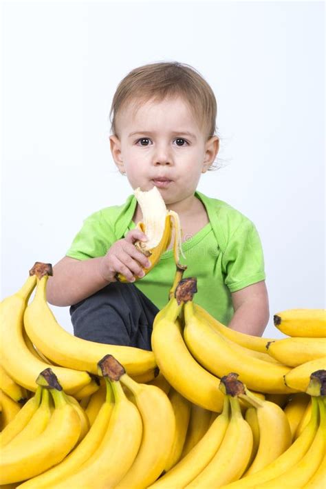 Cute baby eating banana stock image. Image of ripe, health - 84529409