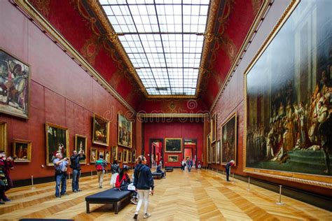 PARIS, FRANCE - OCTOBER 2, 2016: Tourists Visit Art Gallery in Louvre Museum. Louvre Museum is ...