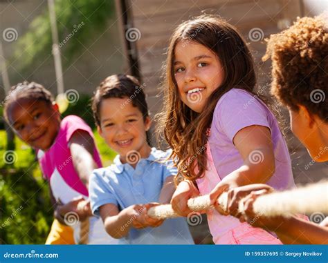 Girl in Group of Diverse Kids Pull Rope Play Game Stock Image - Image of friend, game: 159357695