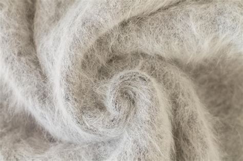 Premium Photo | Swirl of gray alpaca fabric and mohair wool sweater texture