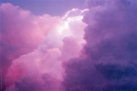 "Surreal Purple Sunset Sky Filled With Clouds" by Stocksy Contributor "Hayden Williams" - Stocksy