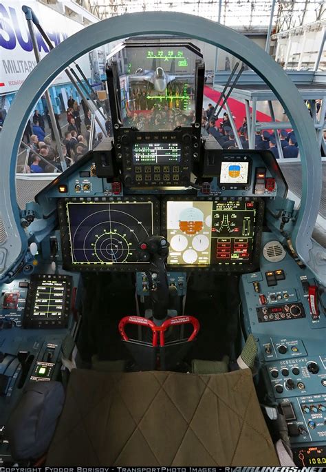 the cockpit of an airplane with many controls