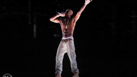 Tupac hologram raps from beyond the grave - CNET