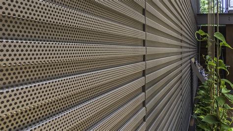 Perforated Wall Paneling | Pod hotels, Metal screens architecture, Wall systems