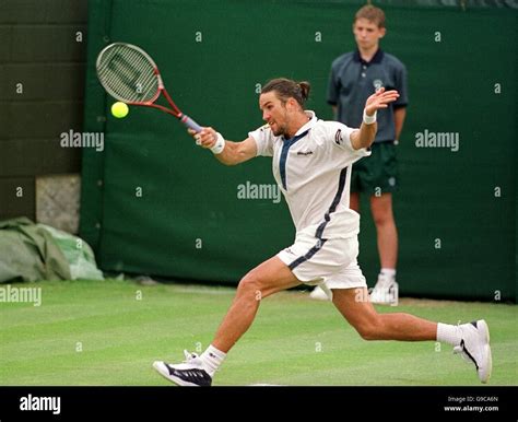 Tennis - Wimbledon Championships - Second Round. Australia's Pat Rafter on his way to beating ...