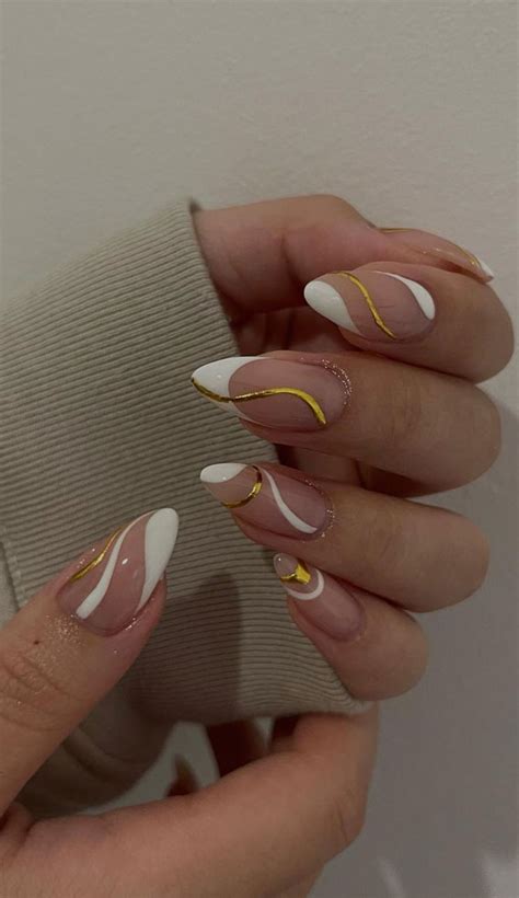 35 Nail Trends 2023 To Have on Your List : White & Gold Swirl Nails