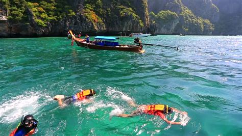 MAYA BAY, THAILAND - CIRCA DECEMBER 2013: Tropical Paradise, Tourists Snorkeling At Maya Bay ...