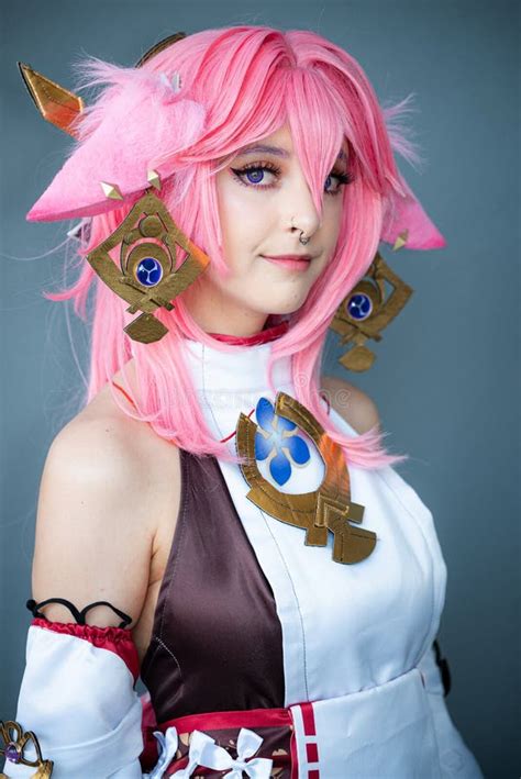 Female Cosplayer in a Pink Anime Costume Wearing Pink Hair Stock Image ...