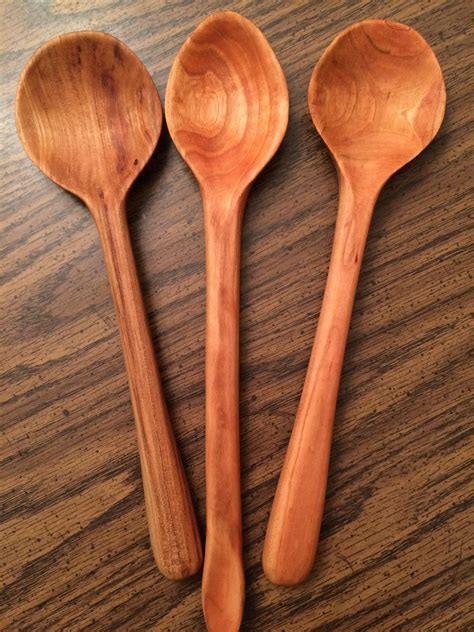 Hand carved cherry wood spoons, rubbed with flaxseed oil. Carved by Joey Grant.