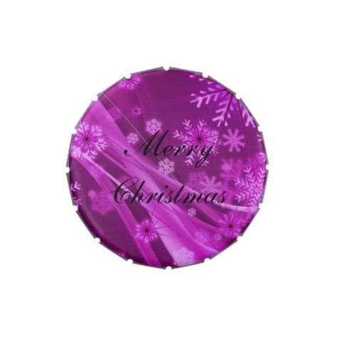 a purple christmas ornament with snowflakes and merry christmas written on it