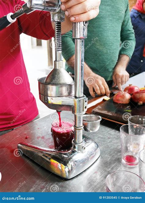 Making pomegranate juice stock image. Image of glass - 91203545