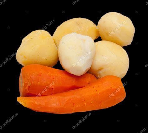 Boiled potatoes and carrots on a black background — Stock Photo © schankz #10241207