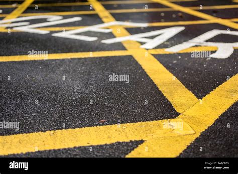 Yellow keep clear sign on road Stock Photo - Alamy