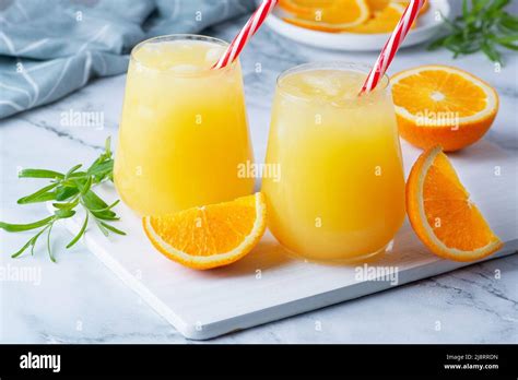 Glass of orange juice with ice. Cold orange fresh. Glass of orange ...