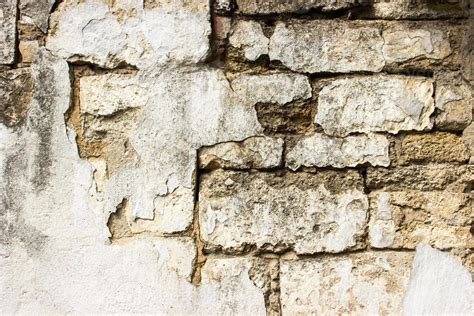 Old damaged brick wall with plaster. Background and textures. 13767473 Stock Photo at Vecteezy