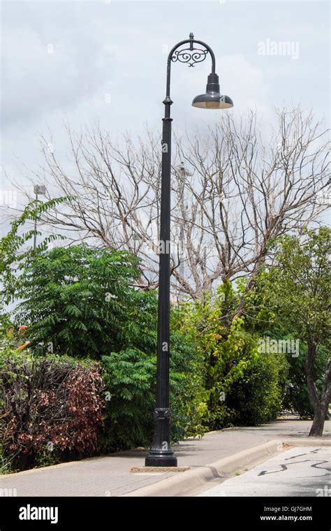 Decorative street light lamp post on sidewalk Stock Photo - Alamy