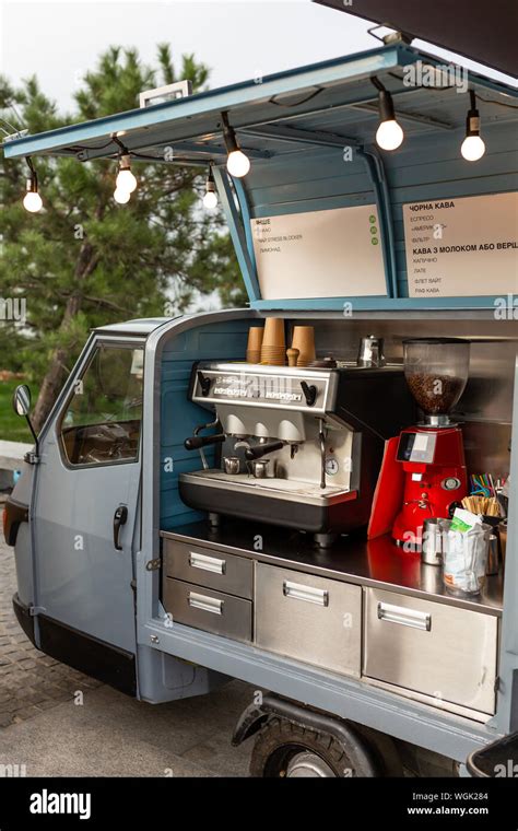 A small car from which they sell coffee. The coffee machine is installed in the car. Street ...