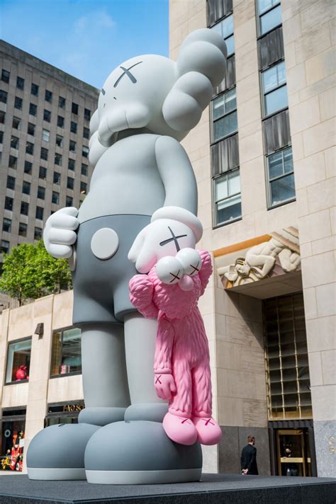 KAWS unveils new 18-foot sculpture at Rockefeller Center | 6sqft