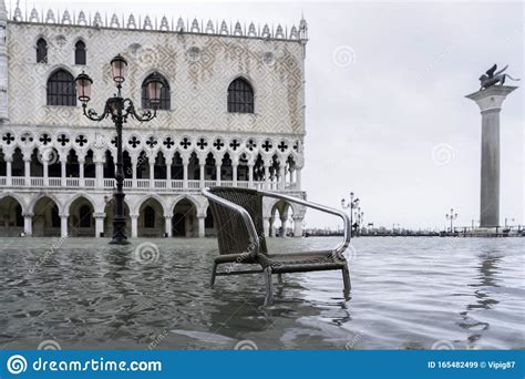 VENICE, ITALY - November 24, 2019: St. Marks Square Piazza San Marco during Flood Acqua Alta in ...