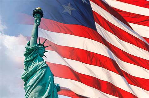 Royalty Free The Statue Of Liberty And The American Flag Pictures, Images and Stock Photos - iStock