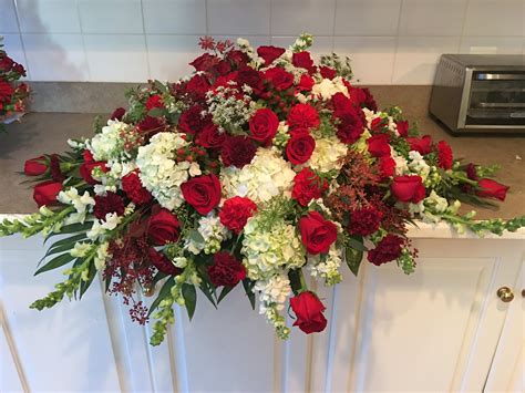 Red and white casket spray in Westminster, MD | Flowers By Wendy Carol