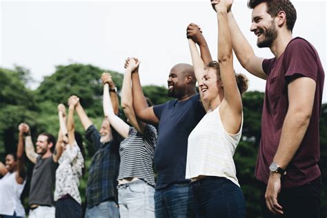 Happy diverse people holding hands in the park – Center of Hope for ...