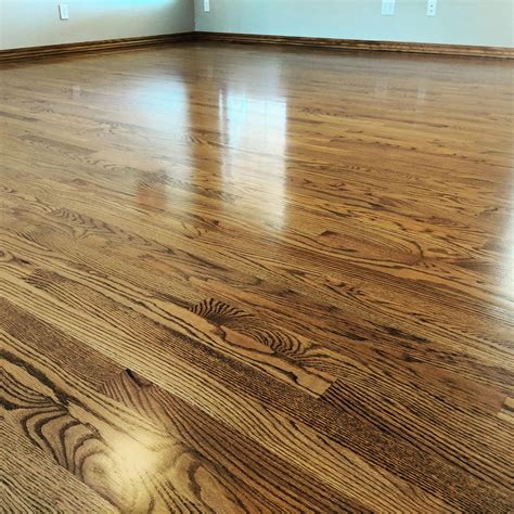 Red oak, stained Early American. Finished with Bone Mega ONE semigloss. Floor had extreme ...