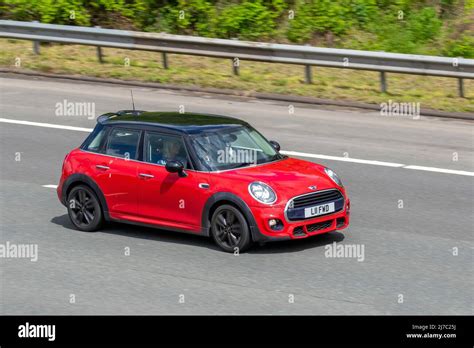 2017 red Mini Cooper One hatchback 1499cc petrol 6 speed manual 2dr with black roof Stock Photo ...