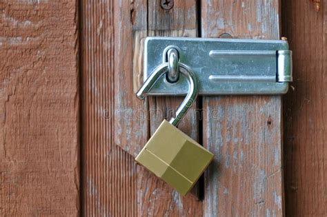 Unlocked Padlock On Door Royalty Free Stock Images - Image: 15769529