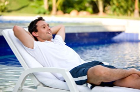 Man relaxing in pool chair copy - Hayward POOLSIDE Blog