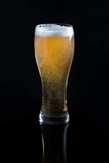 Draft beer in glass on black Photo | Premium Download