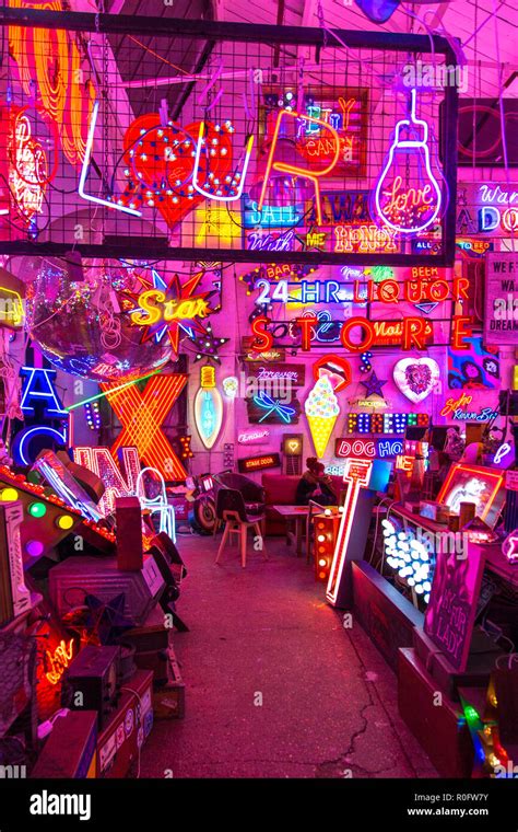 Room full of bright colourful neon signs, neon shop Gods Own Junkyard ...