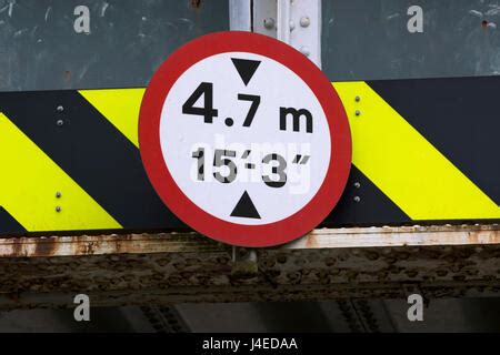 UK bridge clearance height warning sign. Low bridge concept, red triangle warning signs, UK road ...