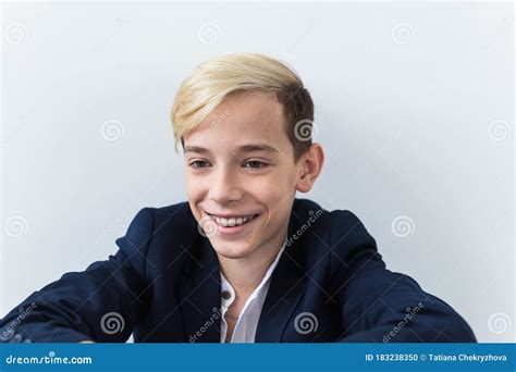 Close-up of Teen Boy with Braces on Teeth Smiling on White Background. Dentistry and Teenager ...