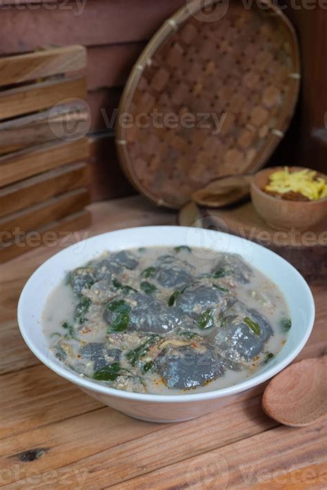 selective focus on food kapurung is a soup with a slightly sour and fresh taste originating from ...