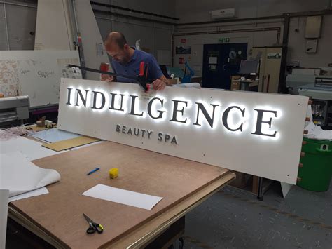 LED illuminated sign in the workshop | Exterior signage, Wayfinding ...