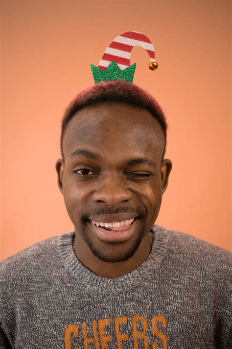 Download Man Wearing Elf Hat Funny Christmas Wallpaper | Wallpapers.com