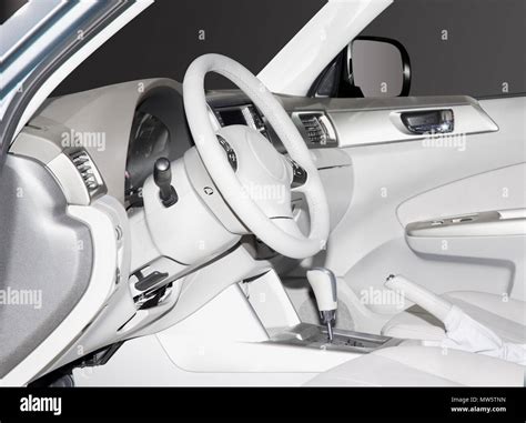 Inside look at a white leather new car interior. Very clean sleek lines and elegant design Stock ...