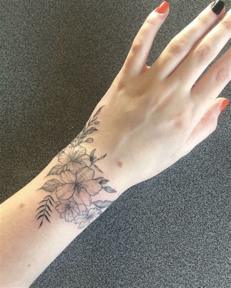 My Wrap Around Wrist Of Flowers in 2024 | Wrap around wrist tattoos, Flower wrist tattoos, Cool ...