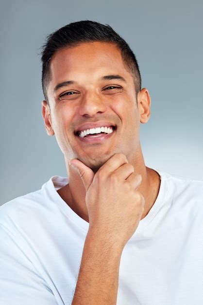 Premium Photo | Man portrait and smile with teeth in fresh or clean hygiene against a grey ...