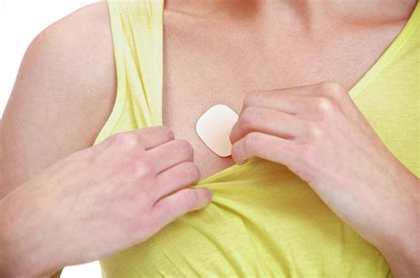 Woman Using A Transdermal Drug Patch Photograph by Lea Paterson - Pixels