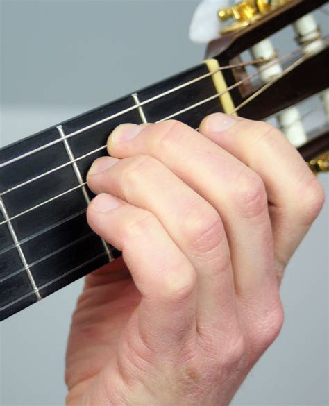 How to Play an E Minor Chord - Notes on a Guitar