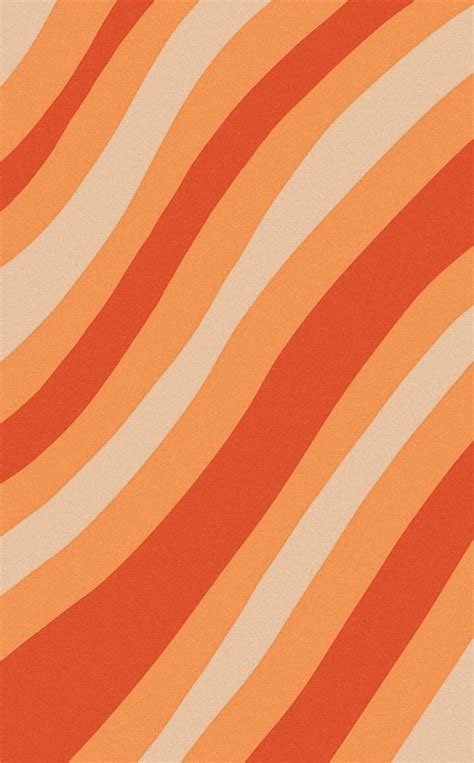 an orange and white striped wallpaper with vertical stripes