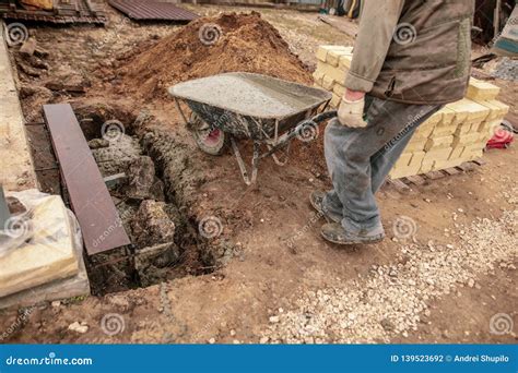 Concrete in a Wheelbarrow at a Construction Site Stock Photo - Image of ...